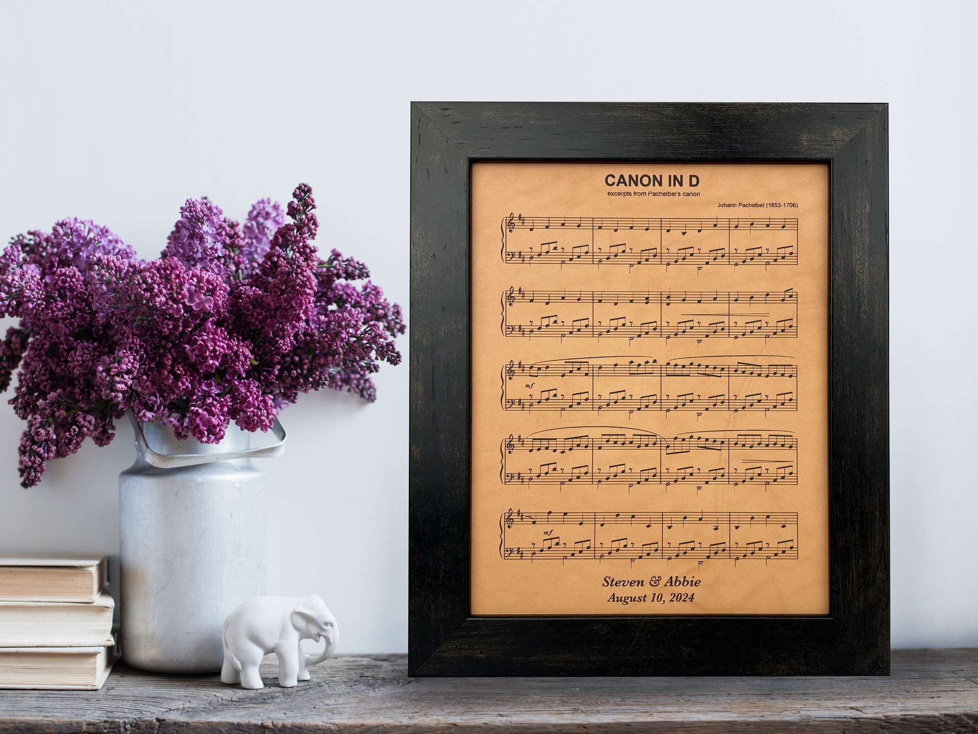 Canon in D sheet music is engraved on leather for a leather anniversary keepsake gift